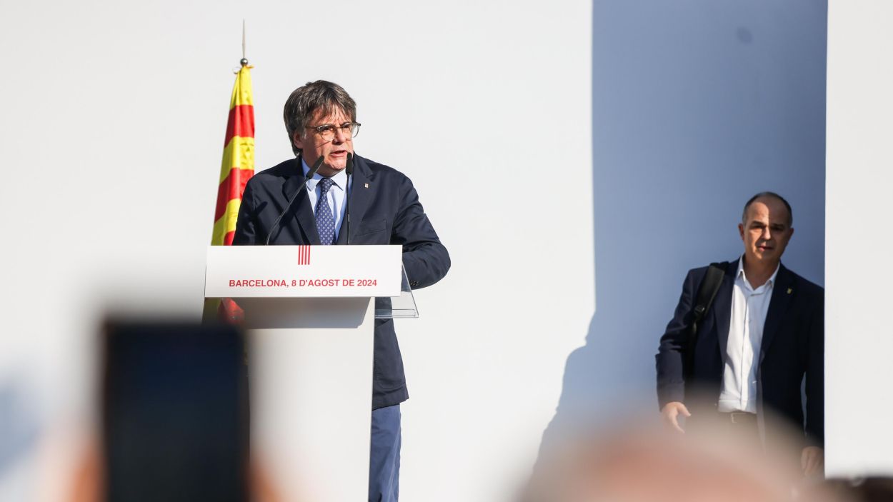 Puigdemont, amb Turull al fons, que ser citat a declarar